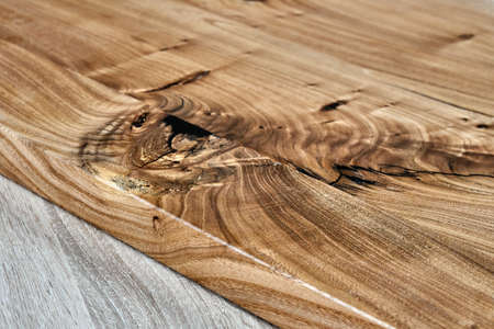 Live edge elm desk countertop in workshop. Close-up