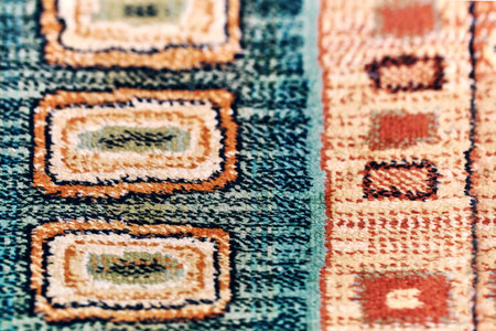 Elegant beige and blue ethnic traditional handmade carpet decorated with colorful patterns lies on...