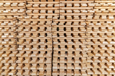 Large stack of new wooden lattices made of natural solid birch in contemporary carpentry warehouse close view as backgroundの写真素材