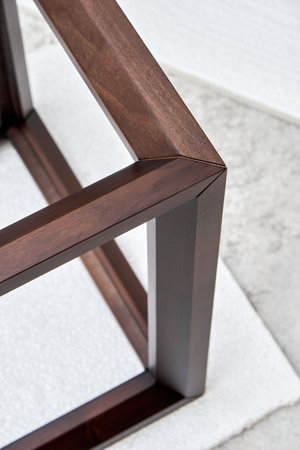 Wooden frame of bedside table made of solid walnut in workshop. Joinery angular joint of planks on dowels closeupの写真素材
