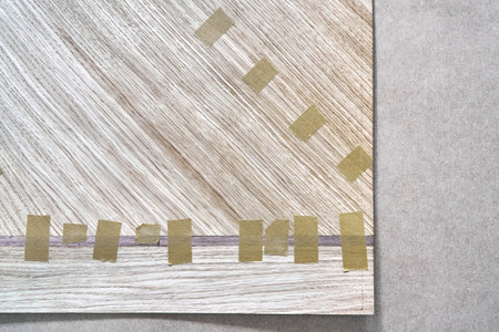 Jointed veneer with tape into canvas for table top of dining table with geometric pattern on...