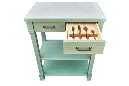 Craved wooden holders for cutlery in open serving table drawer isolated on white background. Unique comfortable device for utensils keeping. Stylish furniture designの写真素材