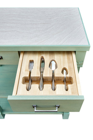 Shiny silverware in craved wooden tray in serving table drawer isolated on white background upper view. Comfortable storage for cutlery keepingの写真素材