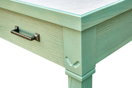 Wooden serving table with drawers and shelves of ash tree massive and green enamel paint isolated on white background closeupの写真素材