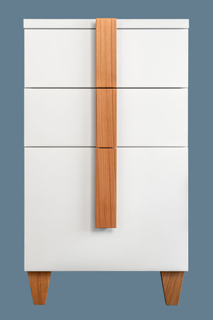 Minimalist white office chest of drawers with natural wooden brown handles and legs isolated on blue background. Stylish furniture modelの写真素材