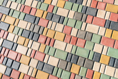 Colorful pavement on sunny day in public park. Colorful paving stones in urban park landscaping...
