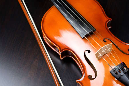 Violin on a dark deskの写真素材