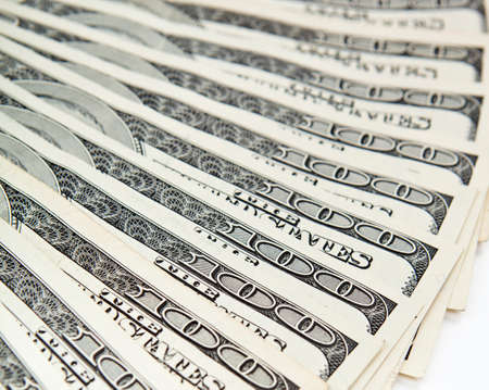 Money spread out like a fan on the table. Background from dollars