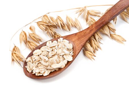 Cereal on a spoon stalk of oats isolated on white backgroundの写真素材