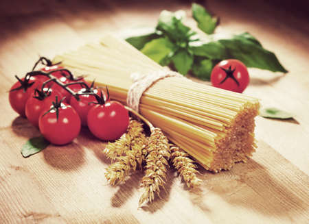 Spaghetti tomato and spices. Italian Cooking. Vintage retro hipster style versionの写真素材