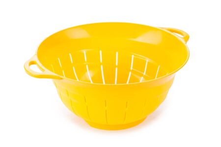 plastic colander isolated on white backgroundの写真素材