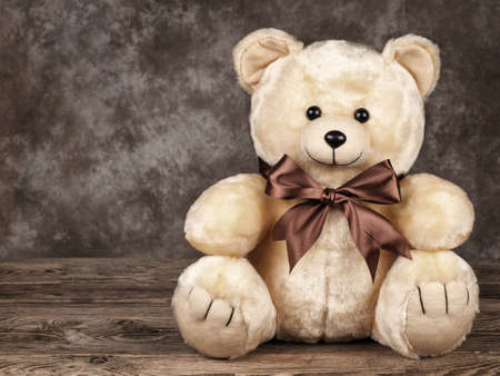 little vintage teddy bear on old boards.の写真素材