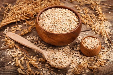 oat flakes on the old board. food concept.