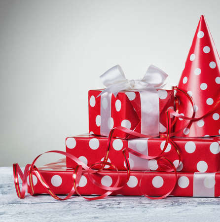 Gift box with white bow ribbon and serpentineの写真素材