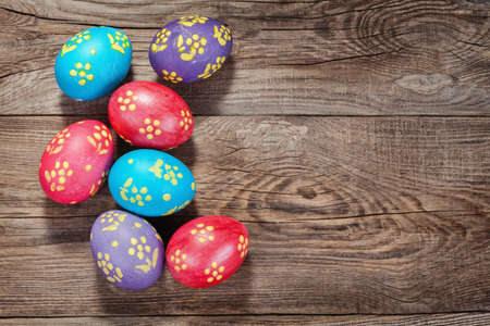 Easter eggs on the old board. Festive concert.