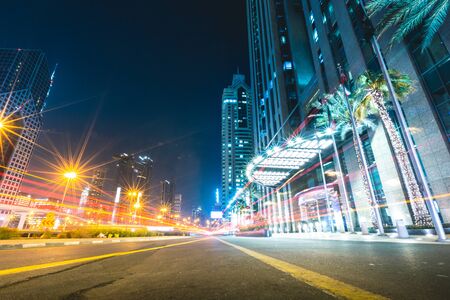 Long exposure of street at night with passing cars Dubai - UAE
