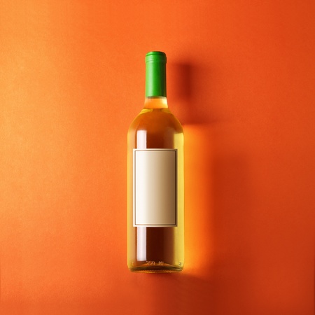 bottle of white wine, orange backgroundの写真素材