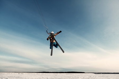 kite in the blue sky, winter riding a kiteの写真素材