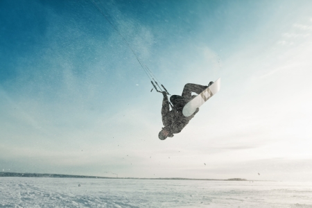 kite in the blue sky, winter riding a kiteの写真素材