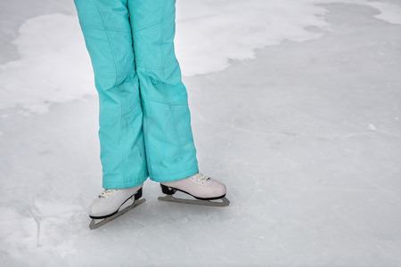 Young girl skating on the frozen lake, figure skatingの写真素材