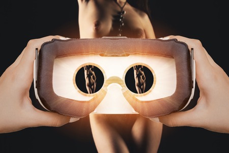 Woman getting experience using VR glasses, for virtual sex, cybersexの写真素材