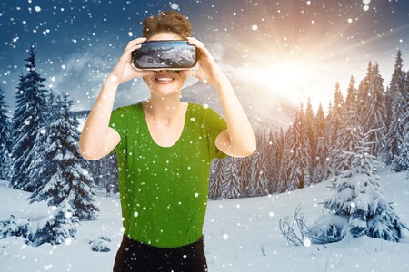 Young girl getting experience VR headset glasses, is using augmented reality eyeglasses, being in a...