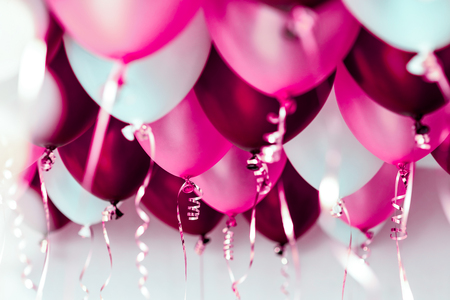 colourful balloons, pink, white, red, streamers isolatedの写真素材