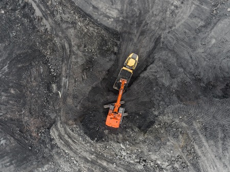 Aerial view open pit mine, loading of rock, mining coal, extractive industryの写真素材
