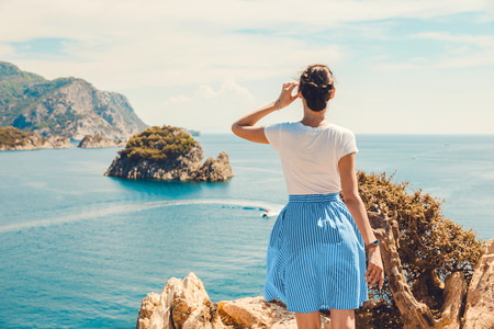 Girl follow me, looking panoramic beautiful view berth of marina. In the Turkish city of Icmeler. View of the island in the bayの写真素材
