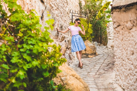 Tourist Girl on Beautiful Streets of old Marmaris. Narrow streets with stairs among the houses from...