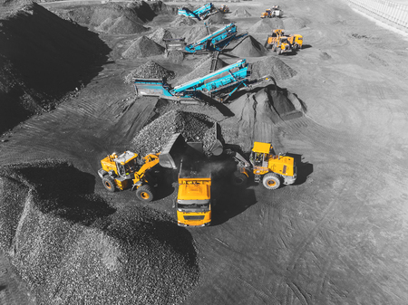 View from above, on the process of sorting coal mined. Open pit mine, Mining coal extractive industry anthracite.の写真素材