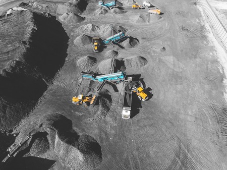 View from above, on the process of sorting coal mined. Open pit mine, Mining coal extractive industry anthracite.の写真素材