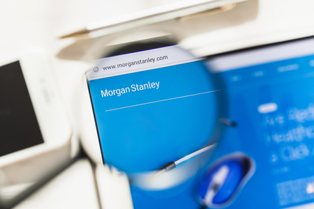 New York, USA - 4 March 2019: Morgan Stanley official website homepage under magnifying glass. Morgan Stanley logo visible on smartphone, tablet screenのeditorial素材