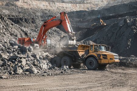 Loading the rock in dumper.