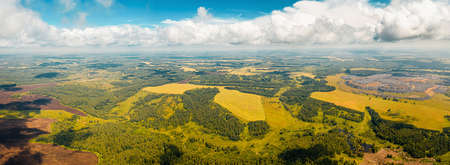 Aerial view of forests, fields and meadows. Nice view from above. Panorama of the village and dump....
