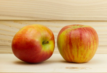 two fresh juicy natural Apple on wooden backgroundの写真素材