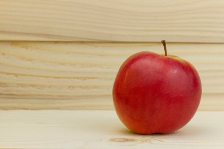 fresh juicy natural Apple on wooden backgroundの写真素材