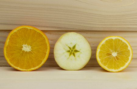 cut fresh juicy natural sour apple orange lemonの写真素材