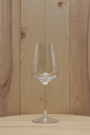 transparent glass standing stand with a wooden backgroundの写真素材