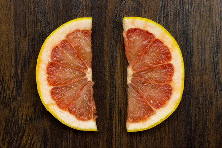 grapefruit red juicy fresh tropical sliced exotic vitamin fruitの写真素材
