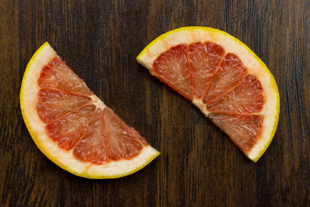 grapefruit red juicy fresh tropical sliced exotic vitamin fruitの写真素材
