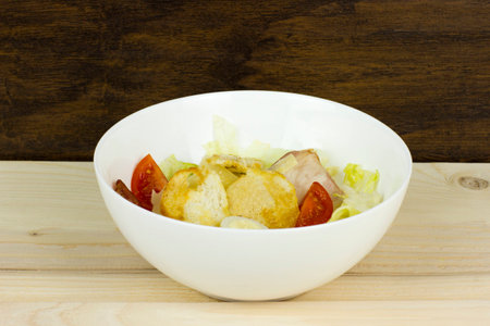 Caesar salad delicious healthy food tomatoes croutons Parmesan cheese and fresh mozzarellaの写真素材