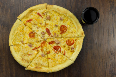 large pizza with  tomatoes and cheese, with ham meat chicken with green sauce delicious fast food is bad food is bad foodの写真素材