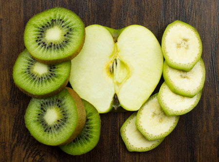 kiwi apple banana beautifully arranged fresh juicy vitamins tropicalの写真素材