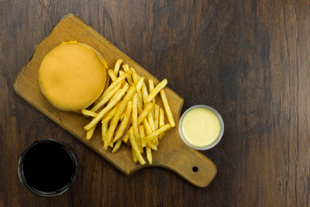 cheeseburger fries  sauce food junk food fast food food cheese meat bad food not healthy breadの写真素材