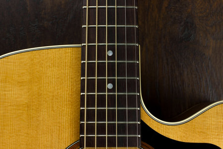 acoustic guitar neck fingerboard frets strings music case close inlay creativity art sound vibration play music guitaristの写真素材
