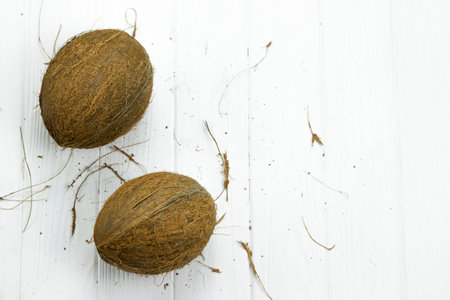 two coconut pulp fresh tropical brown white organic coconut milkの写真素材
