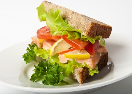 sandwich with boiled red fish on a white backgroundの写真素材