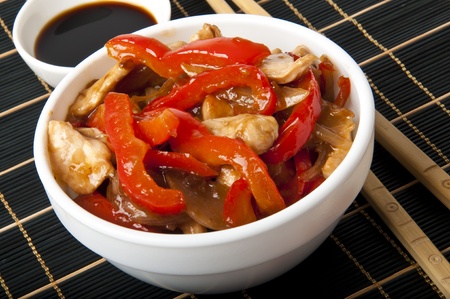 Stir fry chicken with sweet peppersの写真素材