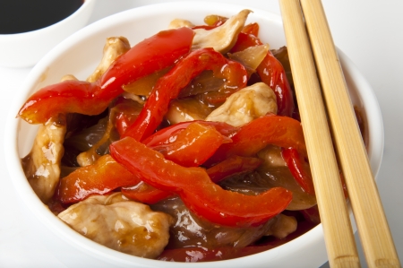 Stir fry chicken with sweet peppersの写真素材